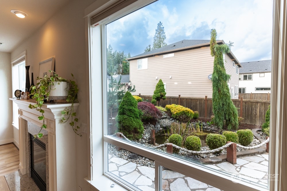 3825 221st Place Southeast Bothell, WA 98021 - Photo 18 of 40 a view of a potted plant with a window
