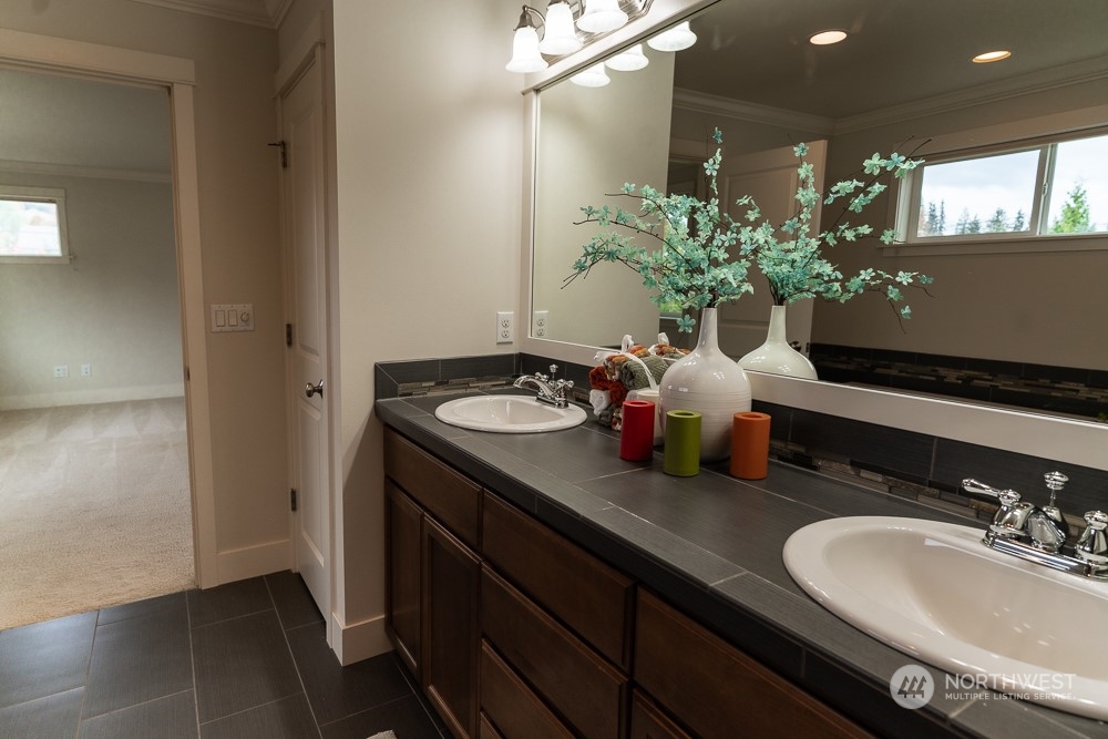 3825 221st Place Southeast Bothell, WA 98021 - Photo 27 of 40 a bathroom with a sink double vanity and a mirror