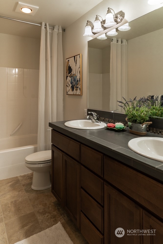 3825 221st Place Southeast Bothell, WA 98021 - Photo 31 of 40 a bathroom with a sink a toilet and shower