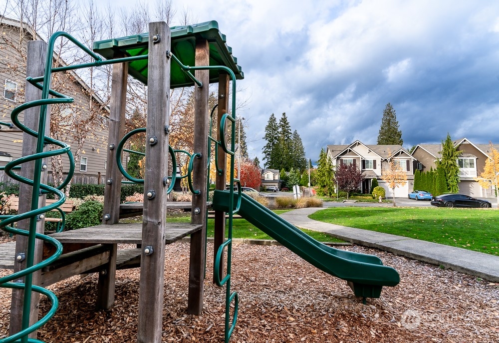 3825 221st Place Southeast Bothell, WA 98021 - Photo 6 of 40 a childrens park with lots of swings and slides