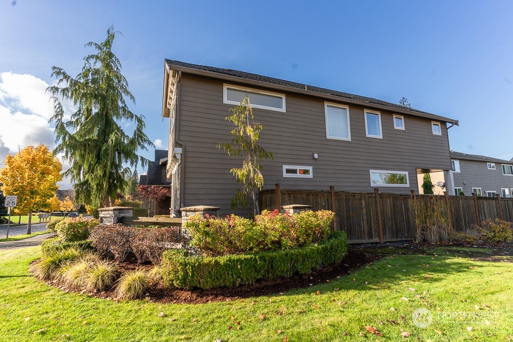 3825 221st Place Southeast Bothell, WA 98021 - Photo 10 of 40 a front view of a house with a yard