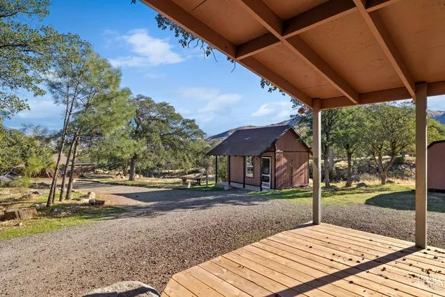 a wooden bench sitting on top of a yard