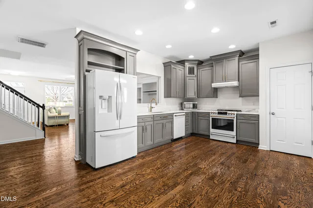 front view of a brick house with large windows