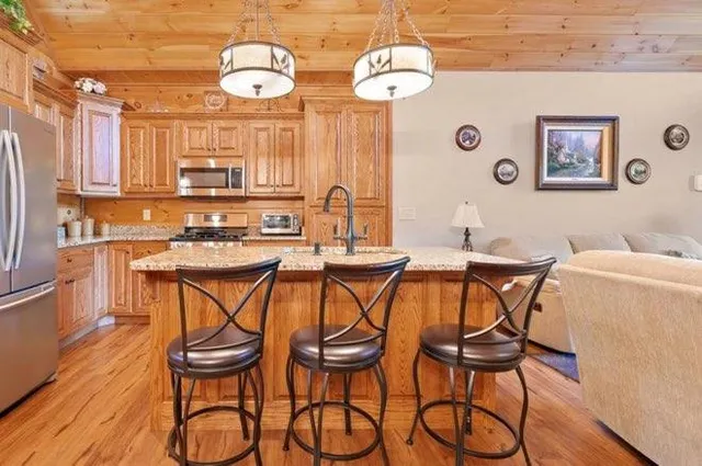 a view of a dining room with furniture wooden floor and chandelier