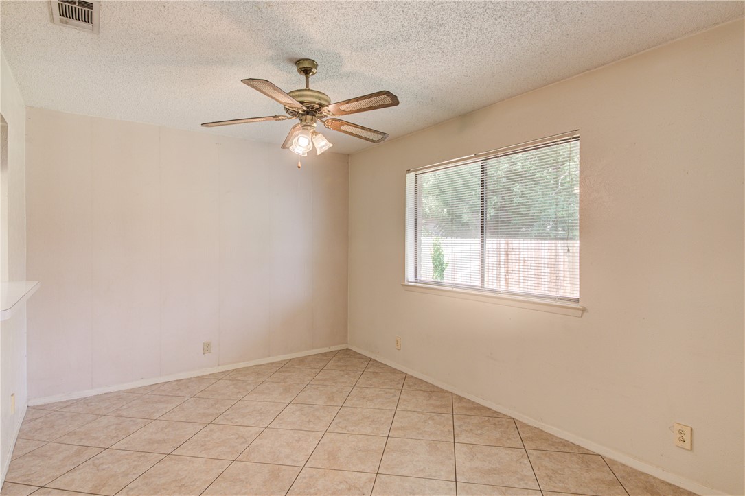 12012 Swallow Drive Austin, TX 78750 - Photo 10 of 33 an empty room with a window and a fan