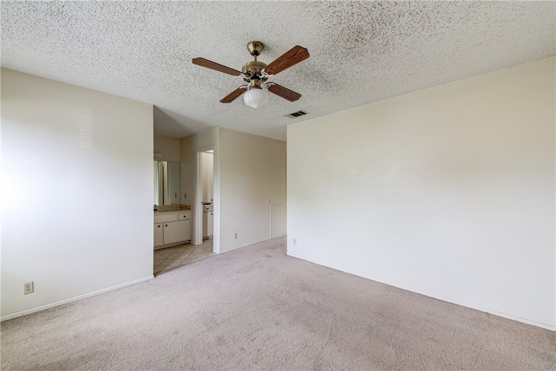12012 Swallow Drive Austin, TX 78750 - Photo 15 of 33 a view of a room with a ceiling fan and a window