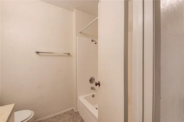a bathroom with a bathtub and sink