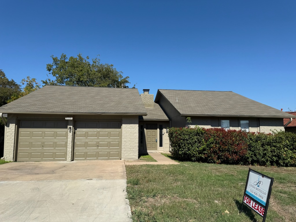 12012 Swallow Drive Austin, TX 78750 - Photo 2 of 33 front view of a house with a garden