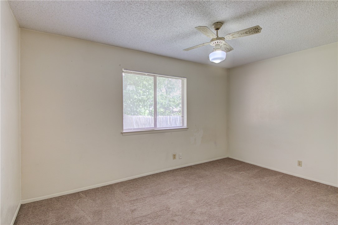 12012 Swallow Drive Austin, TX 78750 - Photo 20 of 33 an empty room with a window and a fan