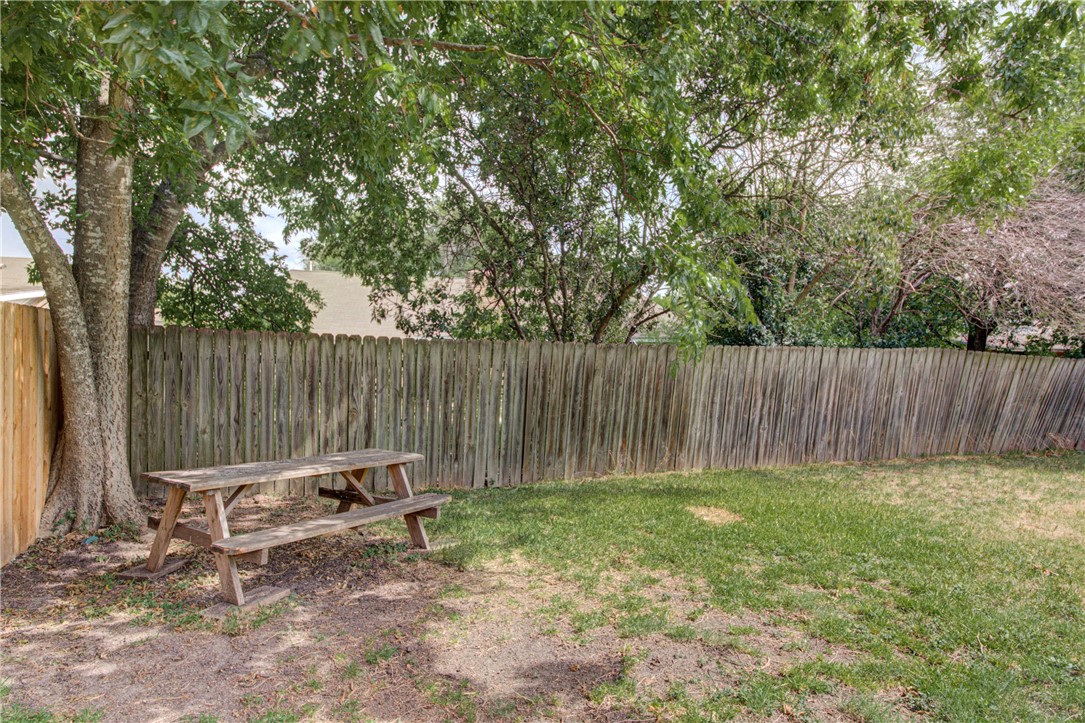 12012 Swallow Drive Austin, TX 78750 - Photo 24 of 33 a backyard of a house with table and chairs