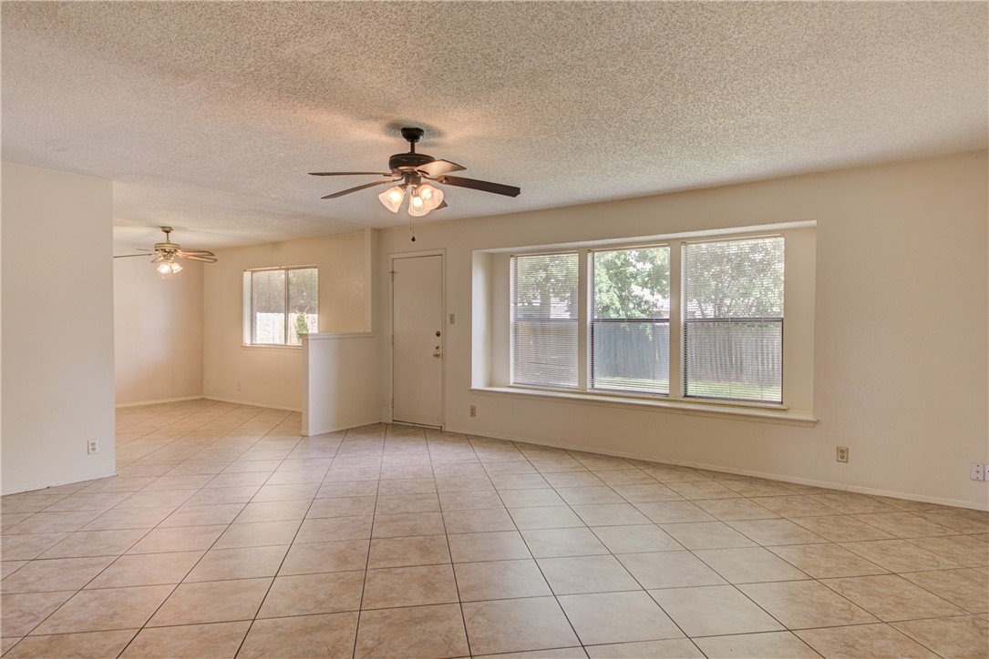 12012 Swallow Drive Austin, TX 78750 - Photo 8 of 33 a view of an empty room with a window and kitchen view