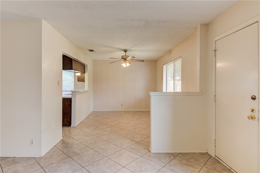 12012 Swallow Drive Austin, TX 78750 - Photo 9 of 33 an empty room with windows and cabinet
