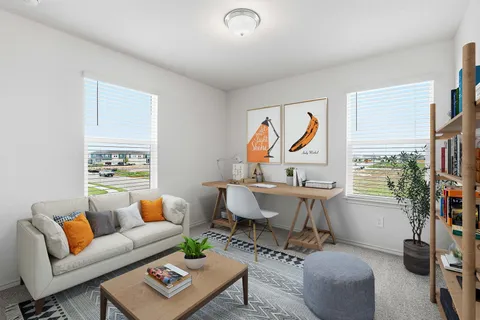 a living room with furniture a rug and a window