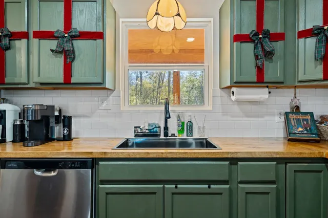 a view of a dining room with furniture wooden floor and chandelier