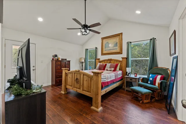 a bed room with a bed window and a television