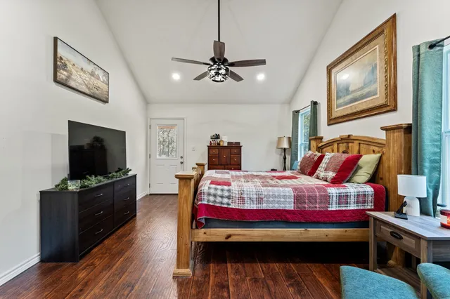 a spacious bathroom with double vanity and a mirror