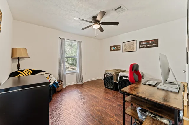 a bedroom with furniture and a bed