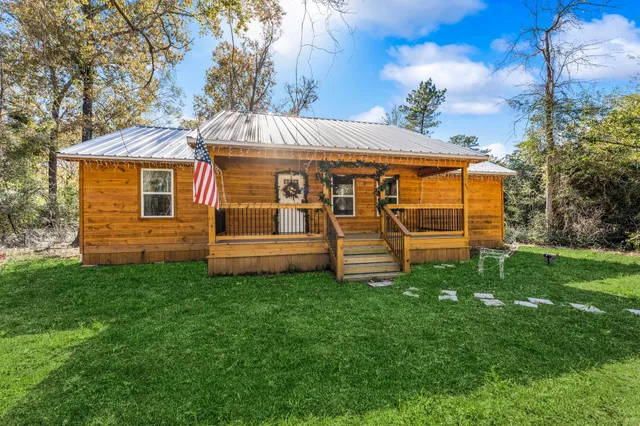 a view of backyard with a garden and entertaining space