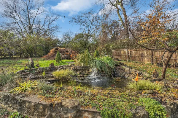 a view of swimming pool with a yard