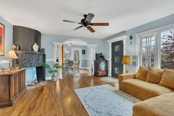 a living room with furniture and a fireplace