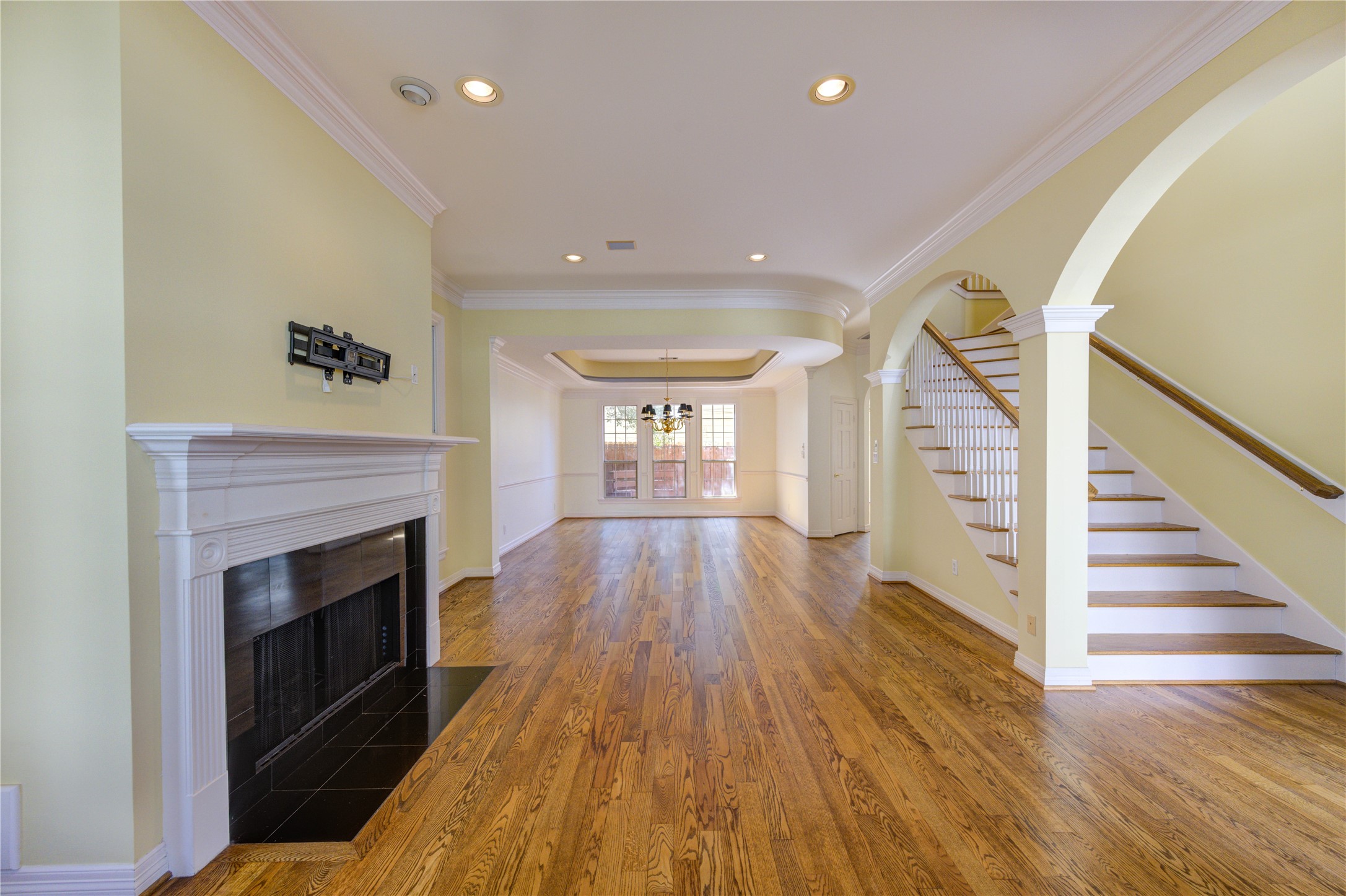 2124 Nantucket Drive, Unit B Houston, TX 77057 - Photo 5 of 35 The open layout flows seamlessly into the formal dining room with tray ceiling and chandelier, creating an ideal space for entertaining.