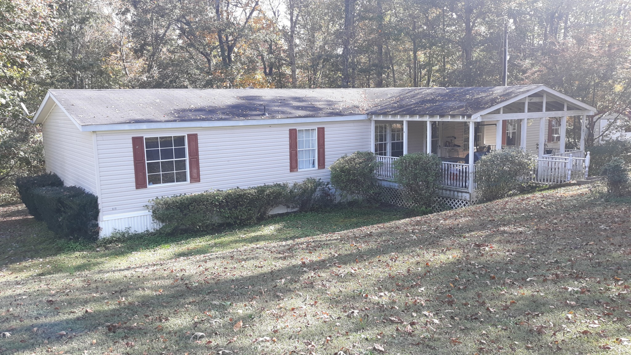 6611 Wesley Ridge Road Lyles, TN 37098 - Photo 1 of 27 a front view of a house with a yard and garage