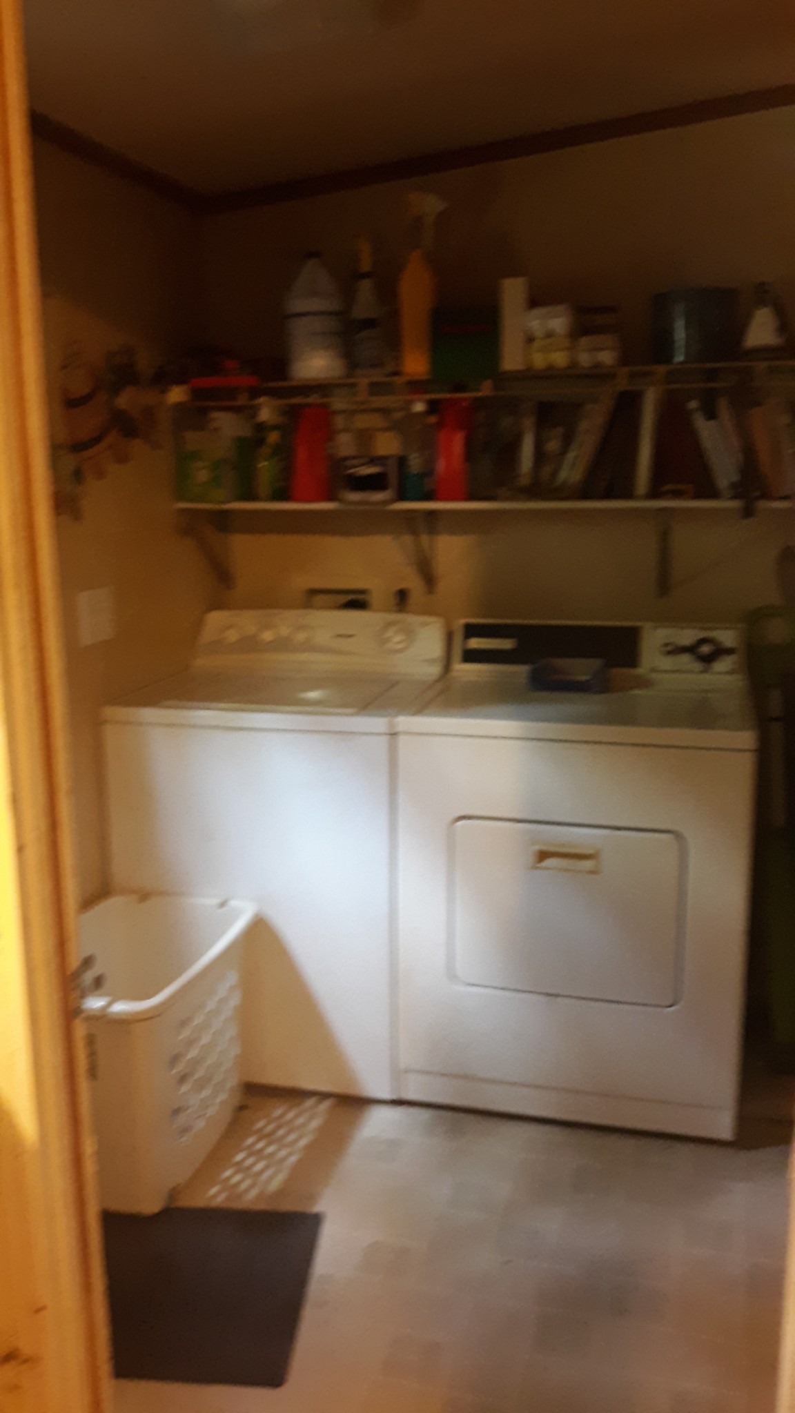 6611 Wesley Ridge Road Lyles, TN 37098 - Photo 12 of 27 a close view of water heater and wooden cabinets