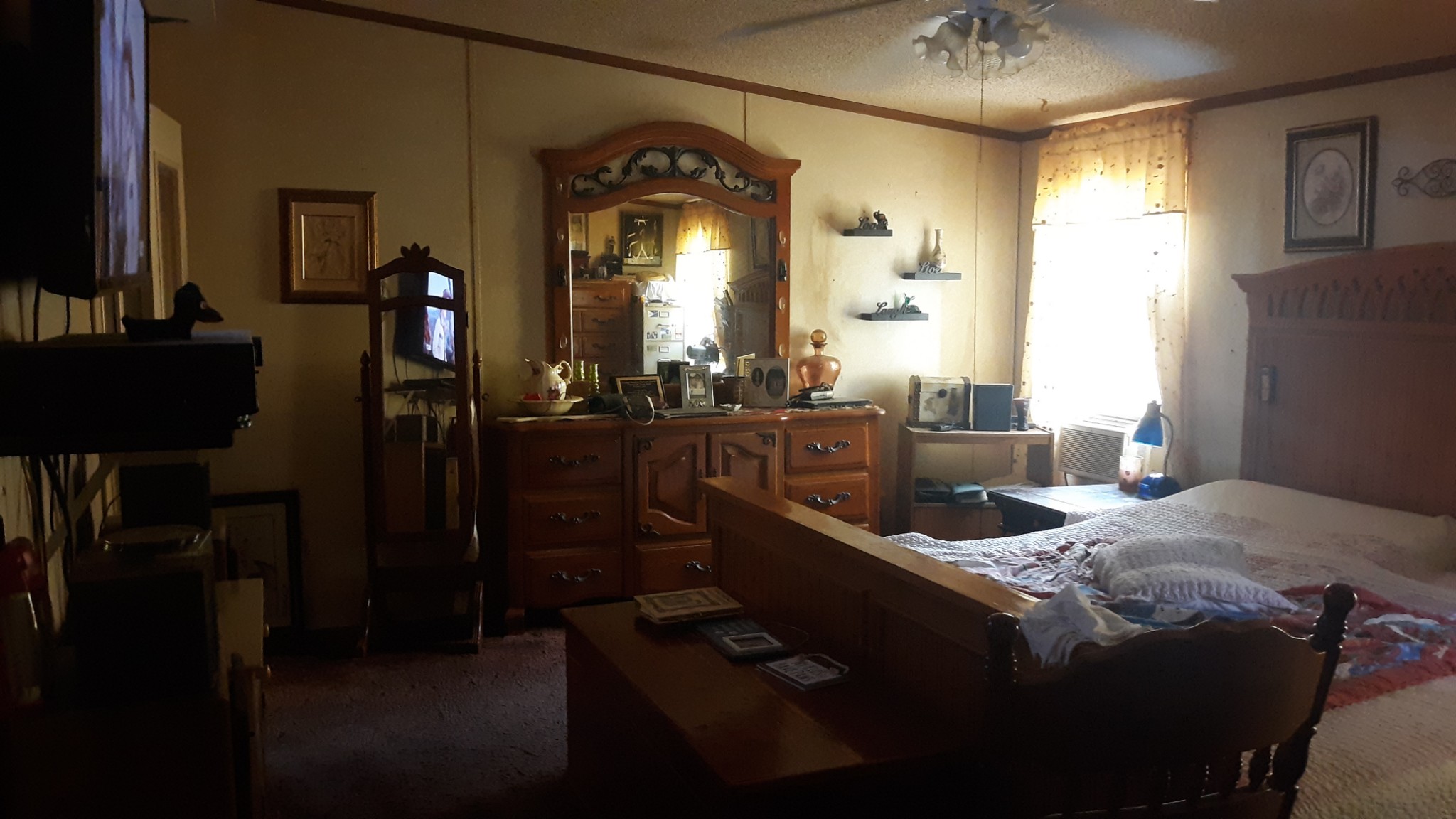 6611 Wesley Ridge Road Lyles, TN 37098 - Photo 17 of 27 a bedroom with a bed and a mirror on the dresser