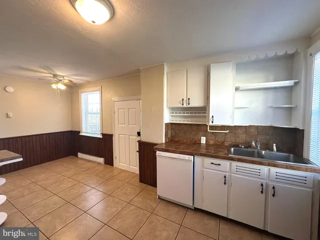 a kitchen with a sink and cabinets