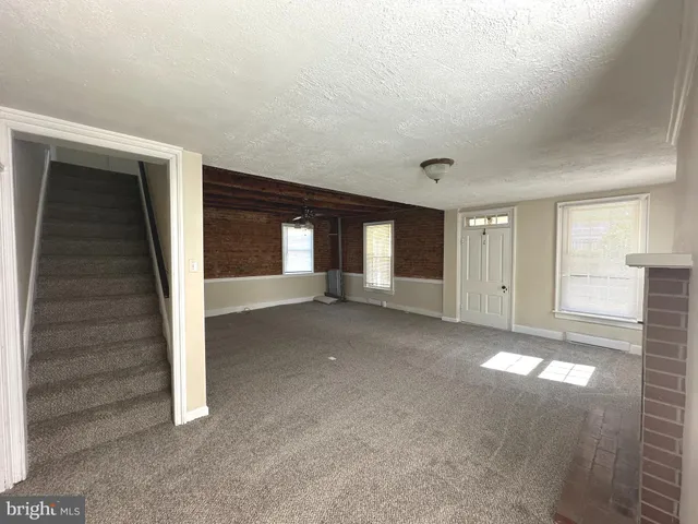 a view of empty room with windows