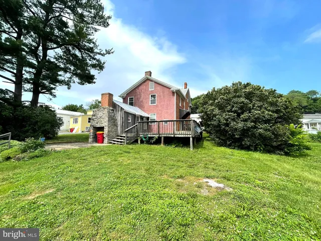 a house with trees in the background