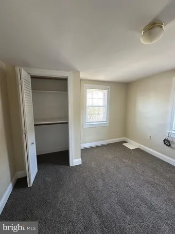 a bathroom with a toilet a sink and shower