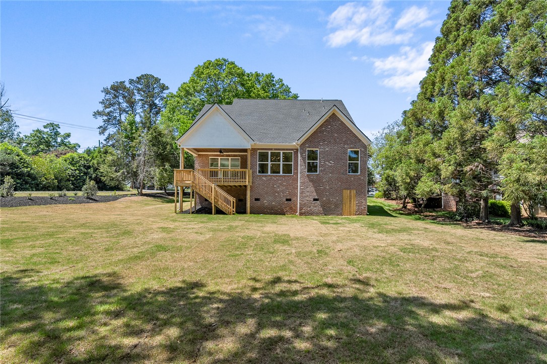 100 Garden Gate Drive Anderson, SC 29621 - Photo 41 of 43 This residence features a brick exterior and a spacious backyard, perfect for outdoor activities.