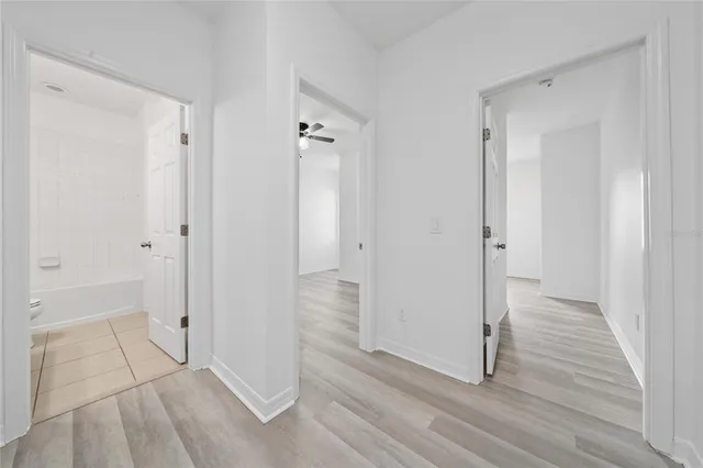 a bed room with a bed and a chandelier