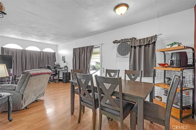 a dinning area with furniture and view of kitchen