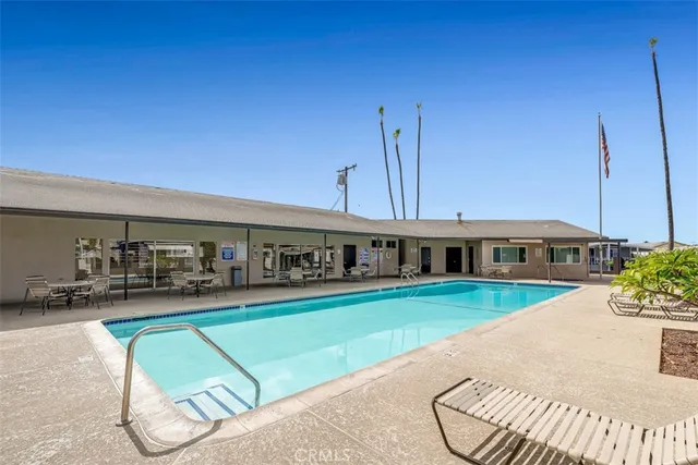 a view of a house with a backyard porch and sitting area