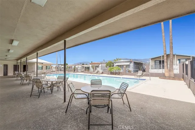 a kitchen with a table chairs and a stove