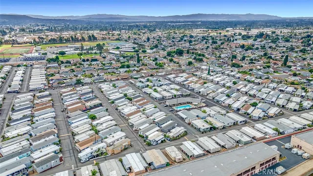 a front view of a house with a garden and plants
