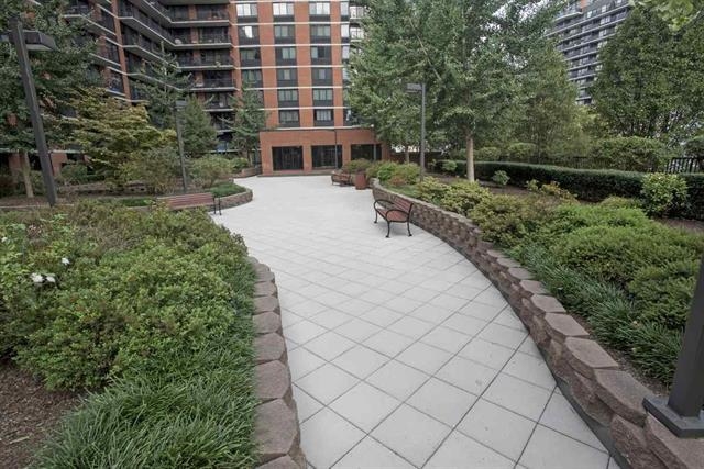 700 Grove Street, Unit 8R Jersey City, NJ 07310 - Photo 9 of 11 a view of house with outdoor space and trees