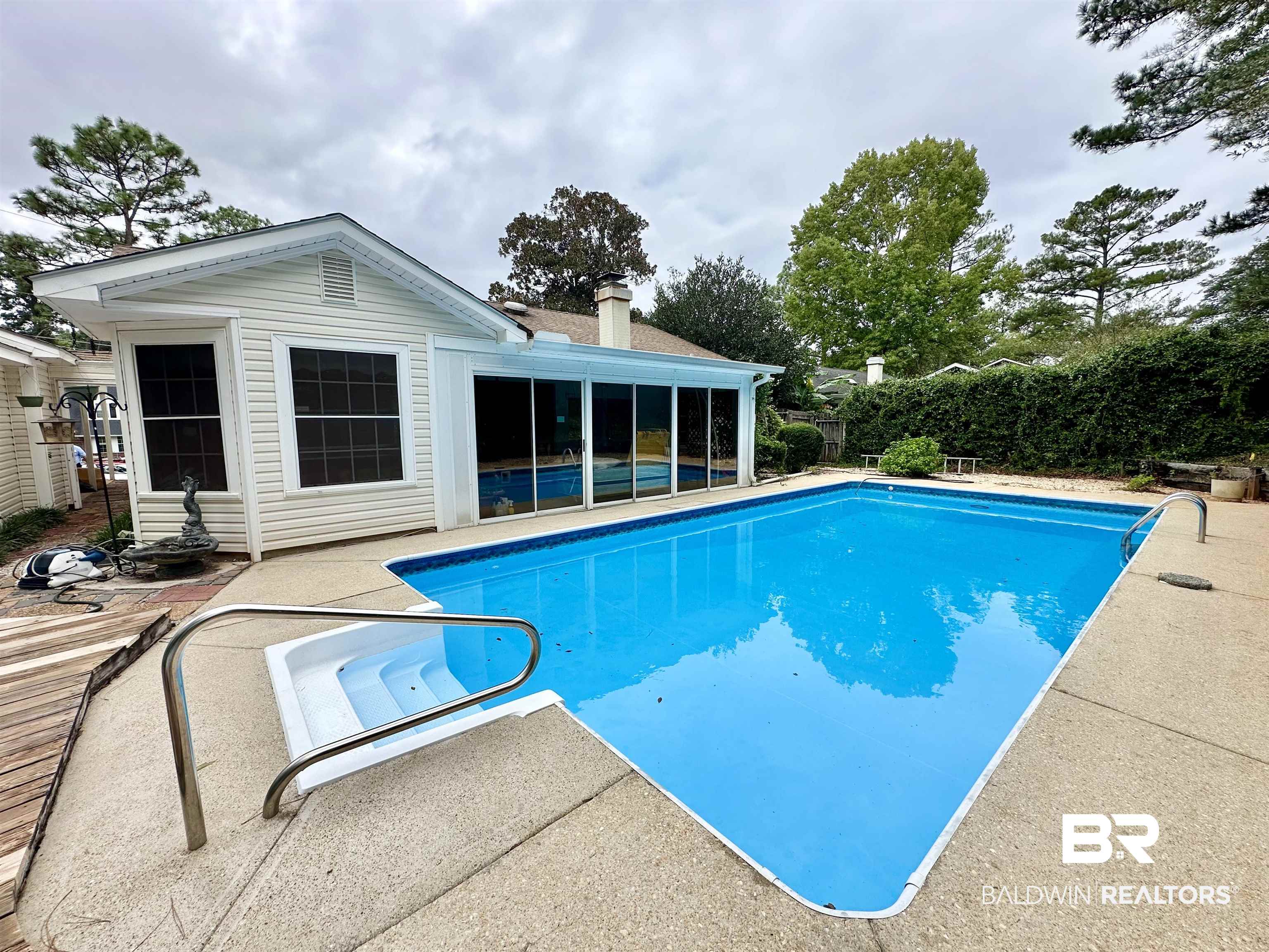 438 Ridgewood Drive Daphne, AL 36526 - Photo 23 of 28 View of pool with a sunroom