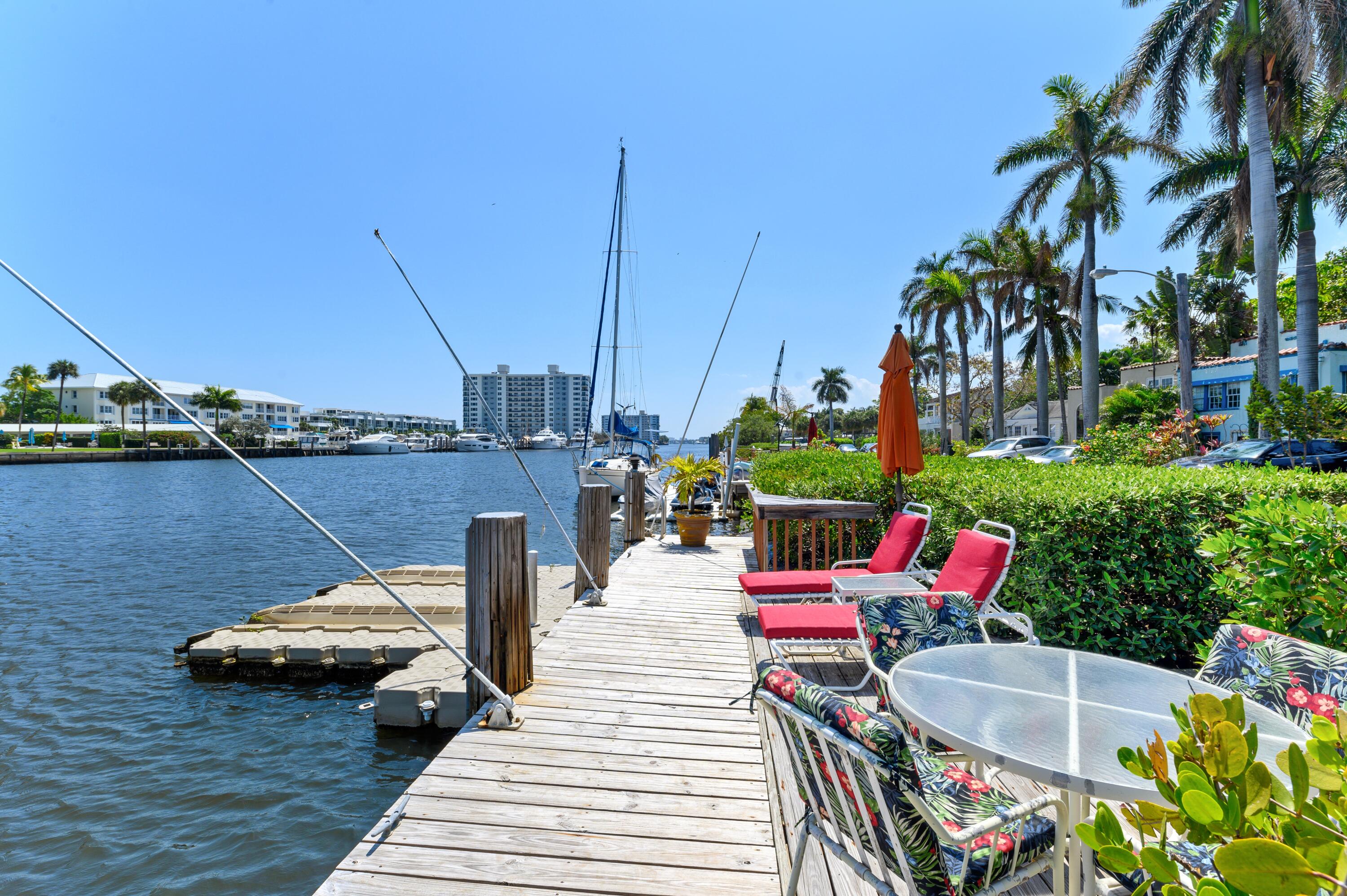 24 Marine Way, Unit 26 Delray Beach, FL 33483 - Photo 18 of 18 a roof deck with table and chairs potted plants with wooden floor