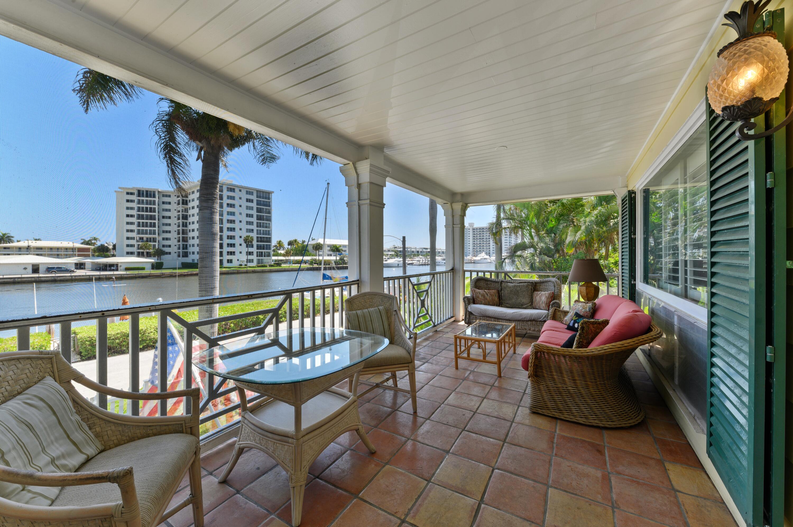 24 Marine Way, Unit 26 Delray Beach, FL 33483 - Photo 2 of 18 a living room with furniture and a floor to ceiling window