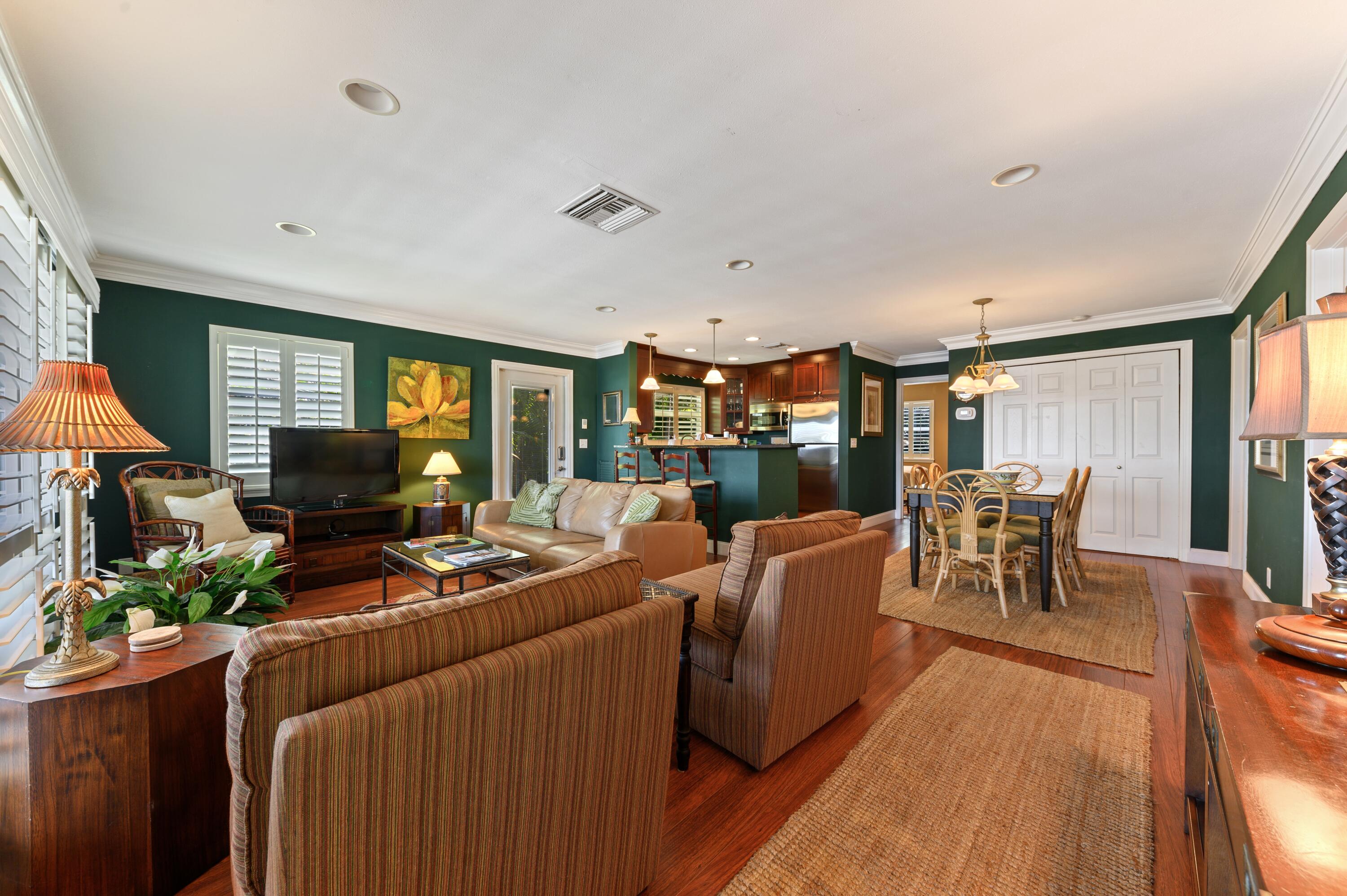 24 Marine Way, Unit 26 Delray Beach, FL 33483 - Photo 4 of 18 a living room with furniture and a large window