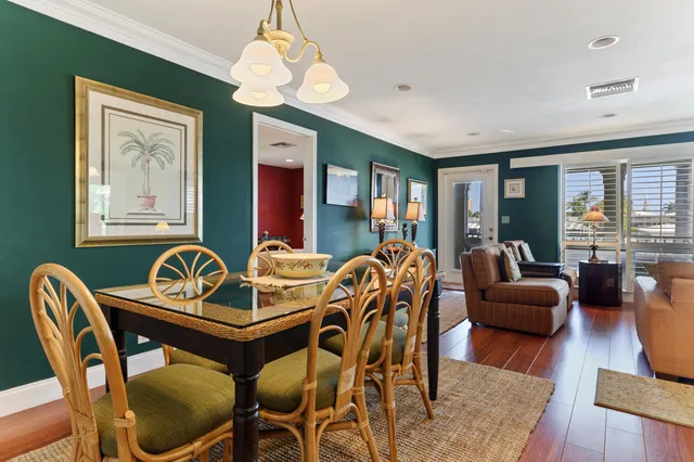 a view of a livingroom with furniture window and wooden floor