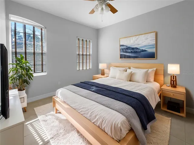 a bedroom with bed and window