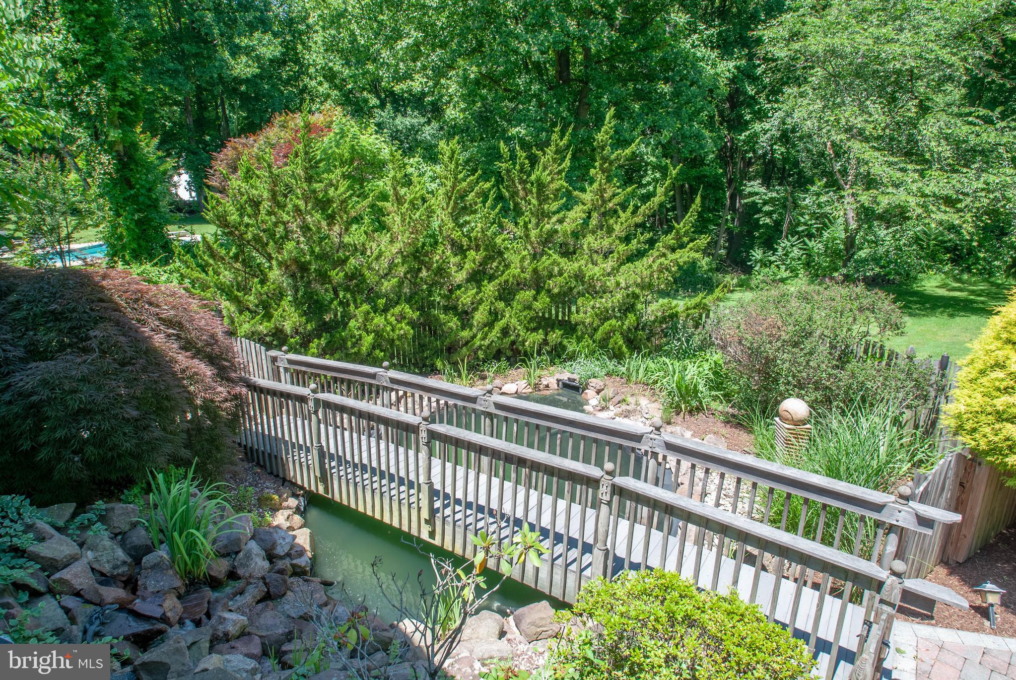 2002 Cortland Road Davidsonville, MD 21035 - Photo 4 of 43 Bonus bridge overlooks KOI fish pond w/ waterfalls