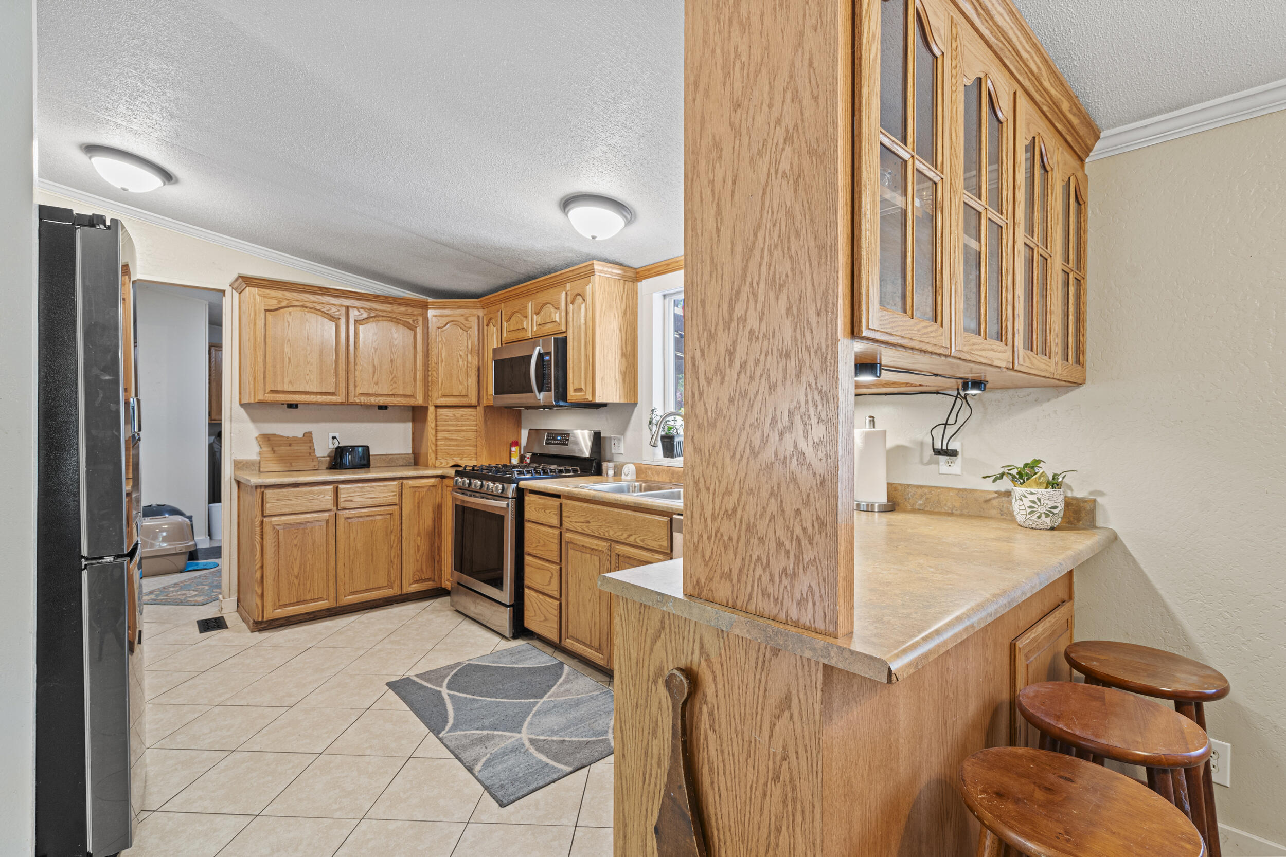 14100 Upper Applegate Road Jacksonville, OR 97530 - Photo 8 of 30 a kitchen with a sink cabinets and counter space