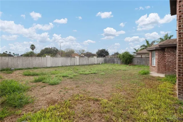 a view of a backyard with large trees
