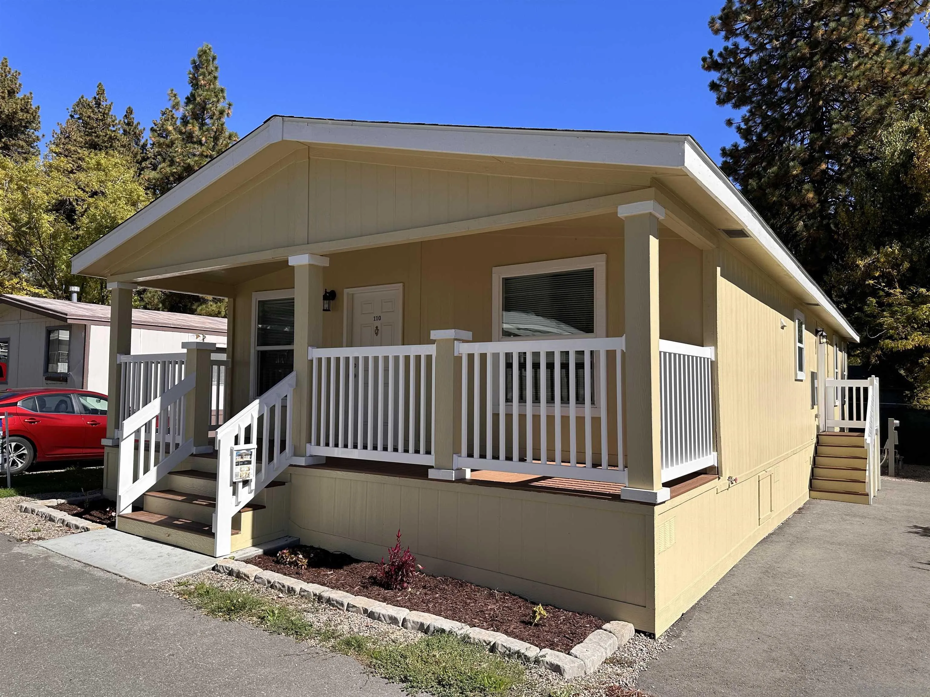 22899 Byron Road, Unit 110 Crestline, CA 92325 - Photo 2 of 5 a front view of a house with a yard