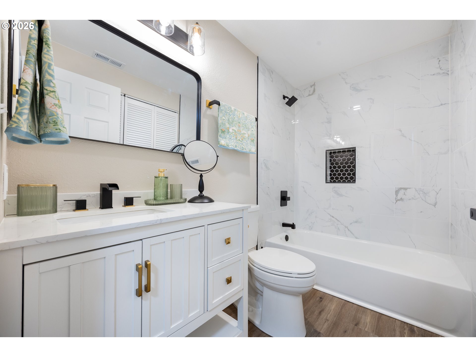 4921 Southwest 59th Avenue, Unit 6 Portland, OR 97221 - Photo 14 of 23 a bathroom with a sink a toilet and shower